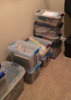 A pile of plastic totes wait to be packed